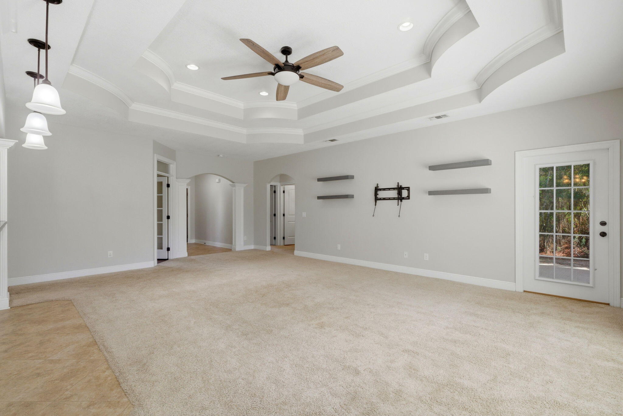 7151 Reef Street Navarre, FL 32566 - Photo 15 of 52 an empty room with windows and ceiling fan