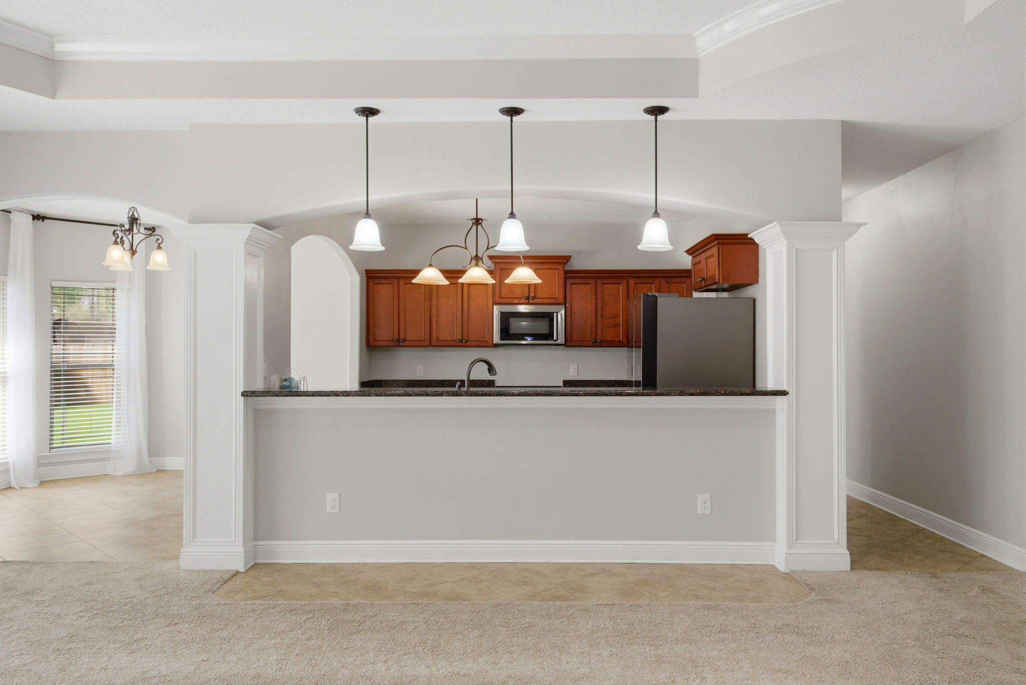 7151 Reef Street Navarre, FL 32566 - Photo 16 of 52 a view of a kitchen with stainless steel appliances