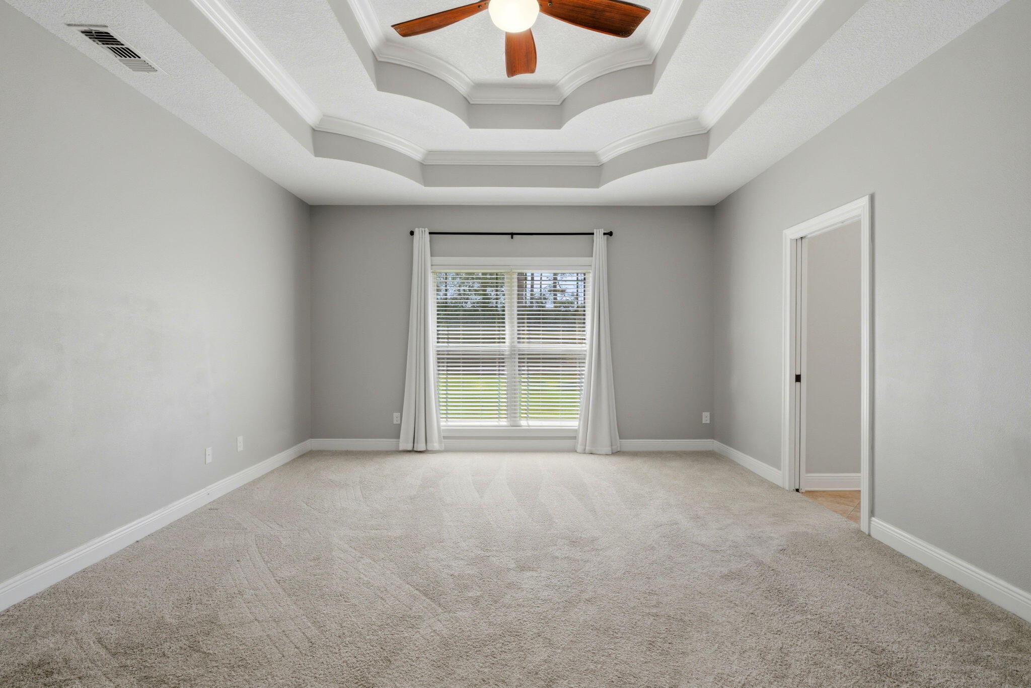 7151 Reef Street Navarre, FL 32566 - Photo 29 of 52 a view of an empty room with a window