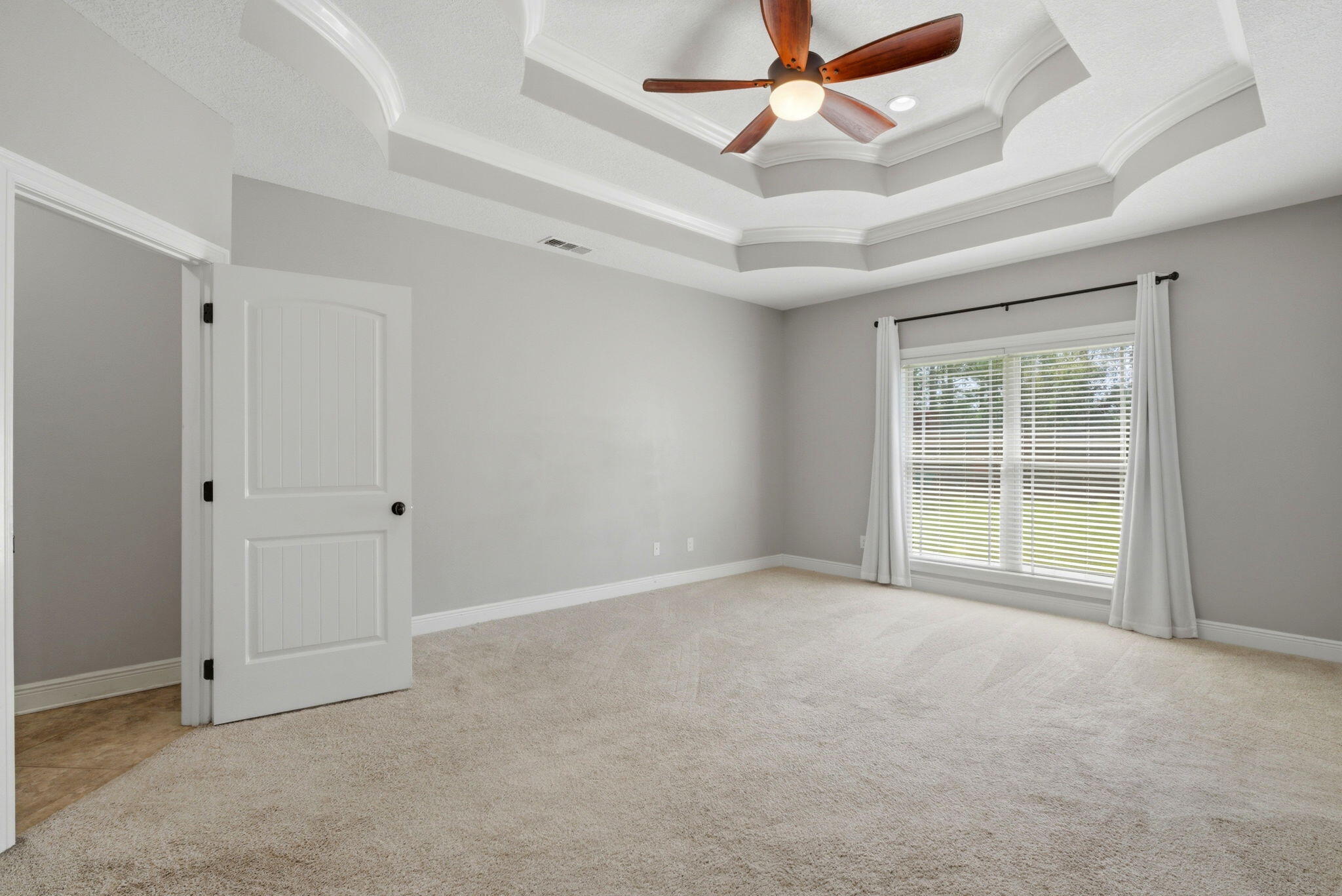 7151 Reef Street Navarre, FL 32566 - Photo 30 of 52 a view of an empty room with a window