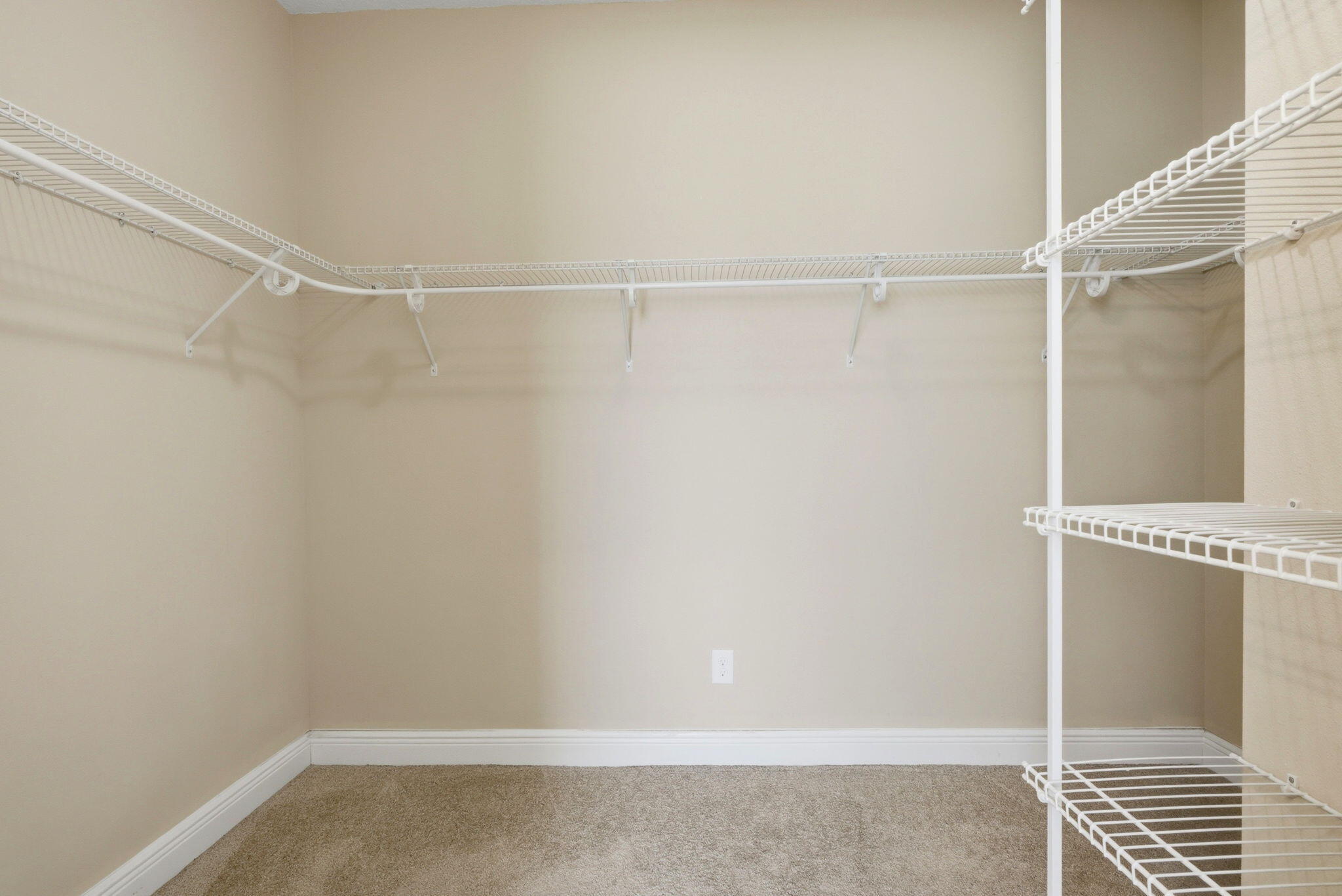 7151 Reef Street Navarre, FL 32566 - Photo 36 of 52 a view of an empty walk in closet