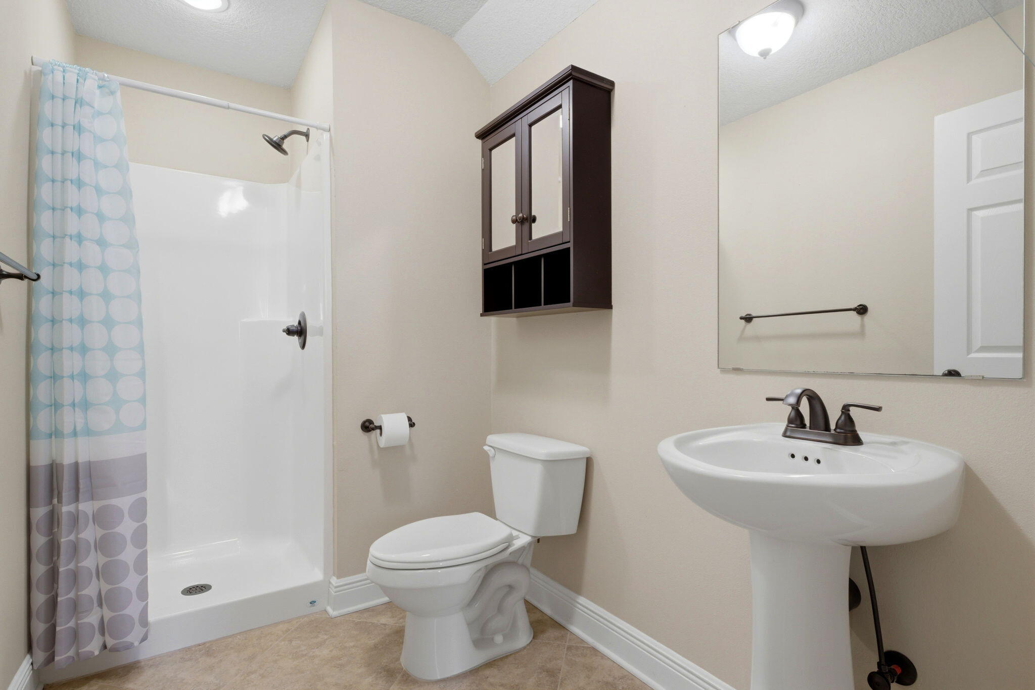 7151 Reef Street Navarre, FL 32566 - Photo 39 of 52 a bathroom with a sink toilet and shower