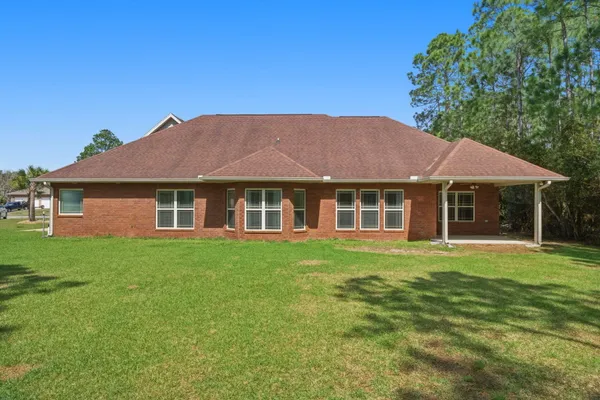 a view of a house with a big yard
