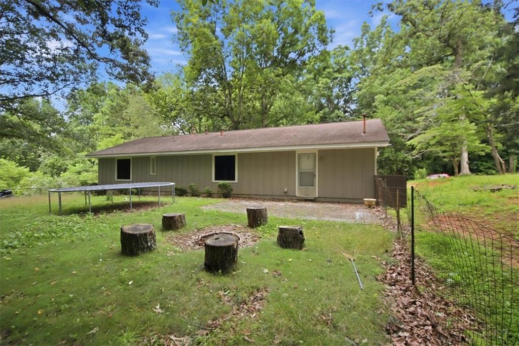 142 Deer Run Canton, GA 30114 - Photo 24 of 24 a view of a house with a yard and sitting area