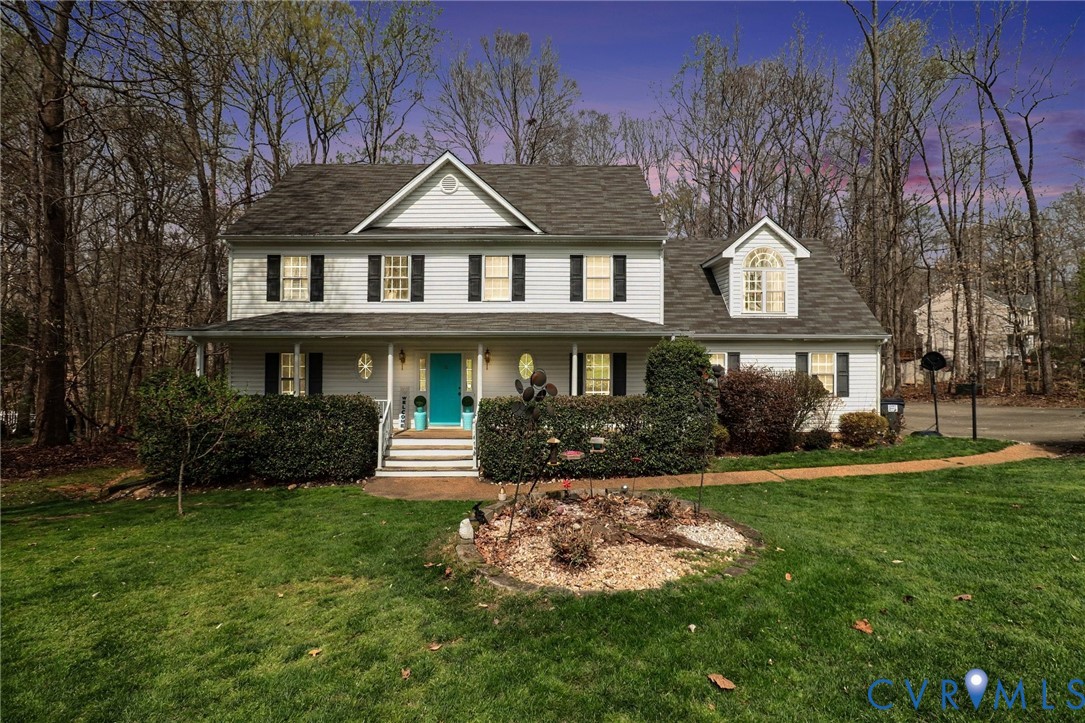3247 Sherwood Ridge Drive Powhatan, VA 23139 - Photo 1 of 30 a front view of a house with a yard and trees