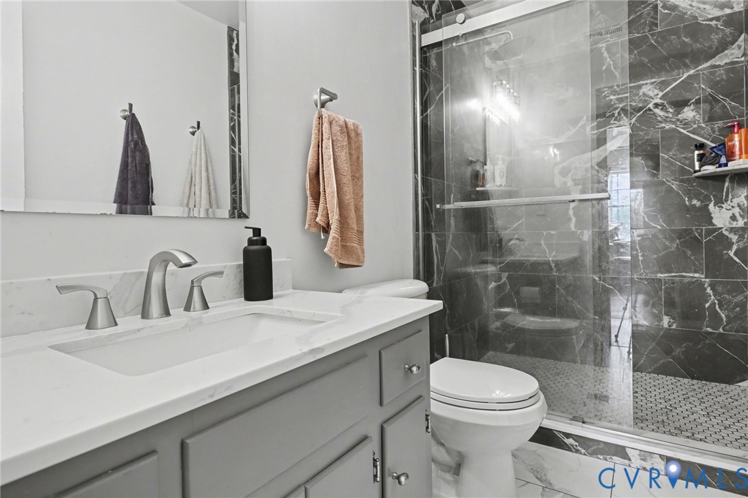 3247 Sherwood Ridge Drive Powhatan, VA 23139 - Photo 20 of 30 a bathroom with a sink toilet and shower