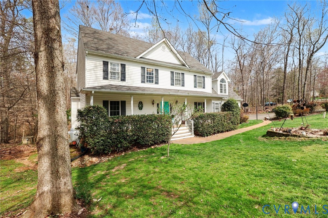 3247 Sherwood Ridge Drive Powhatan, VA 23139 - Photo 2 of 30 a front view of a house with a yard