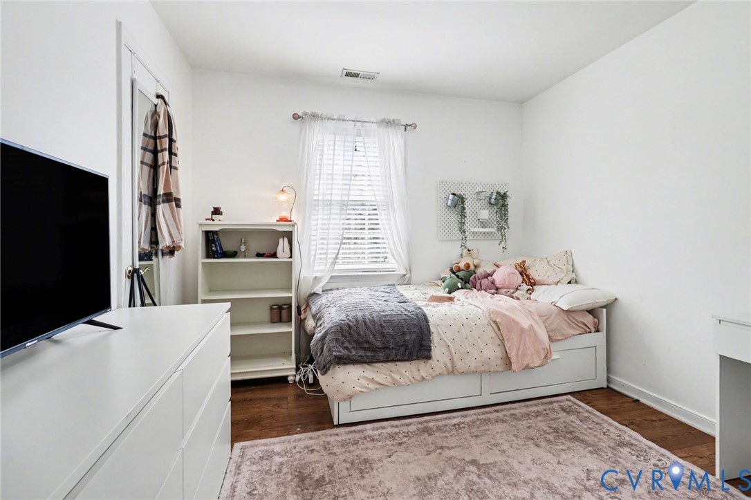 3247 Sherwood Ridge Drive Powhatan, VA 23139 - Photo 21 of 30 a bedroom with a bed and a flat screen tv