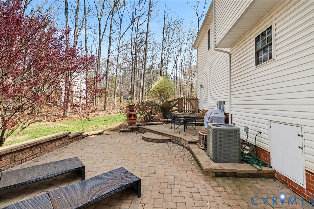 3247 Sherwood Ridge Drive Powhatan, VA 23139 - Photo 22 of 30 a view of a patio with chairs and a table