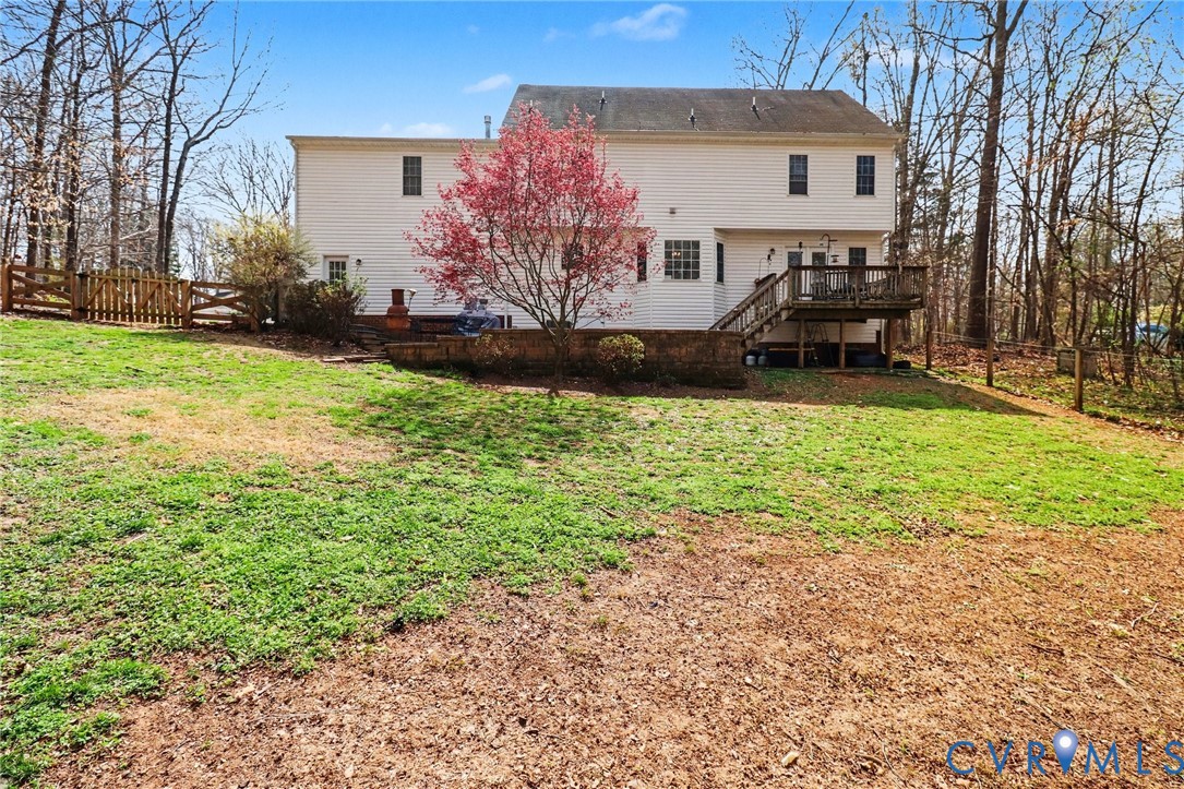 3247 Sherwood Ridge Drive Powhatan, VA 23139 - Photo 25 of 30 a view of a house with backyard and sitting area