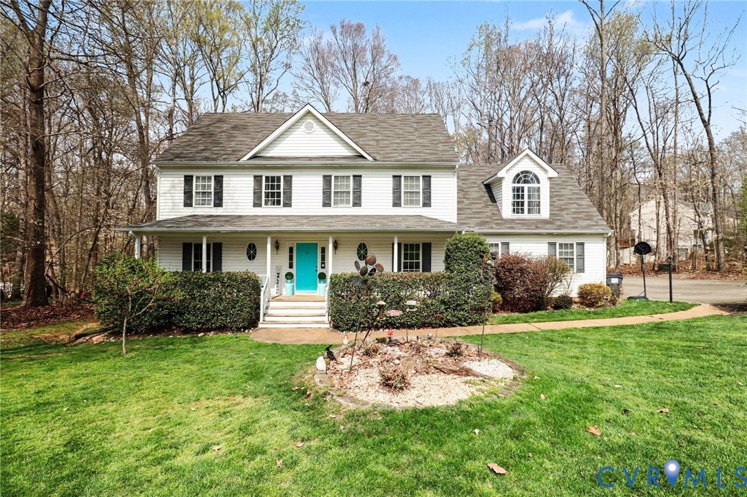 3247 Sherwood Ridge Drive Powhatan, VA 23139 - Photo 3 of 30 a front view of a house with a yard and potted plants