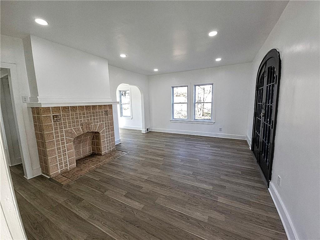 10200 Frankstown Road Pittsburgh, PA 15235 - Photo 12 of 47 an empty room with wooden floor and windows