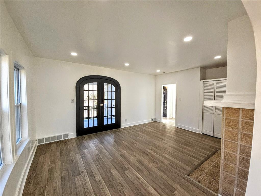 10200 Frankstown Road Pittsburgh, PA 15235 - Photo 16 of 47 an empty room with wooden floor and windows
