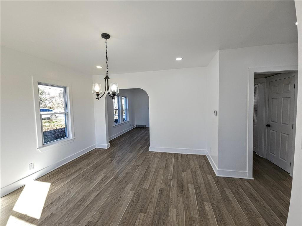 10200 Frankstown Road Pittsburgh, PA 15235 - Photo 19 of 47 a view of a room with wooden floor staircase and a kitchen