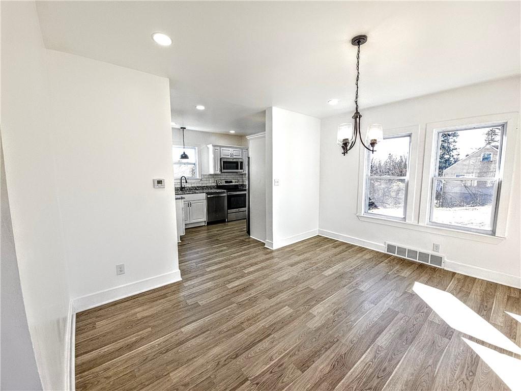 10200 Frankstown Road Pittsburgh, PA 15235 - Photo 20 of 47 a view of empty room with wooden floor and windows