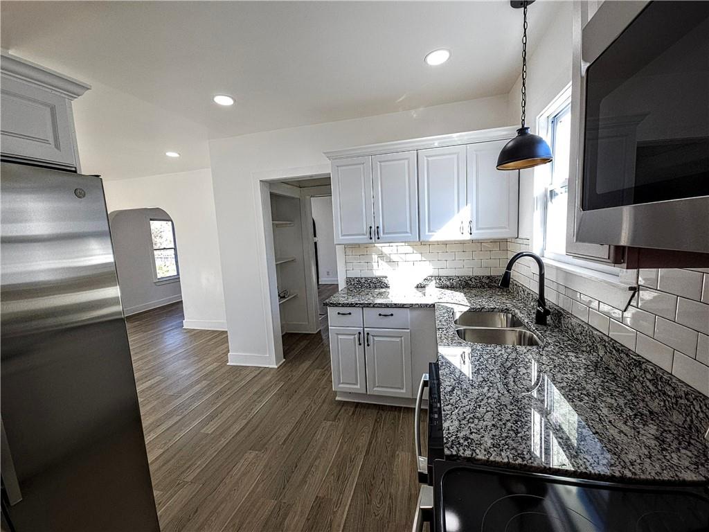 10200 Frankstown Road Pittsburgh, PA 15235 - Photo 22 of 47 a kitchen with refrigerator and cabinets