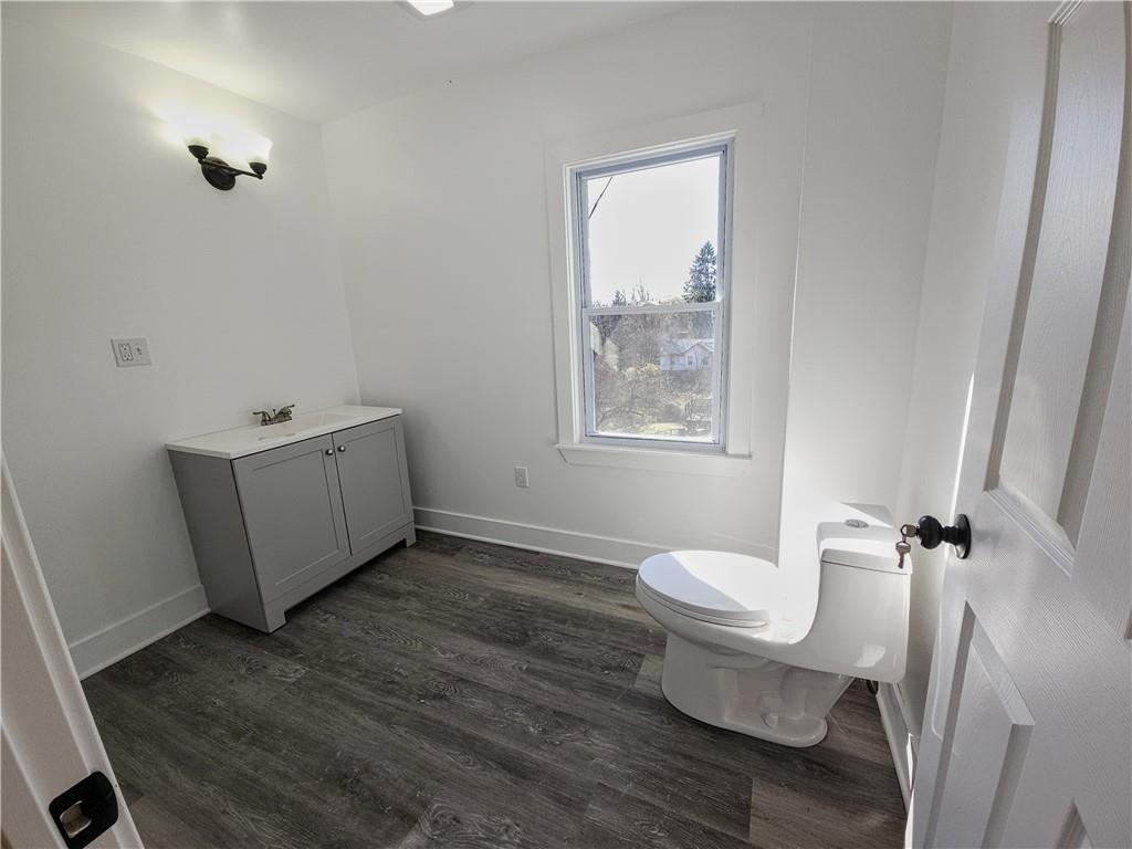10200 Frankstown Road Pittsburgh, PA 15235 - Photo 28 of 47 a view of a room with wooden floor white walls and windows