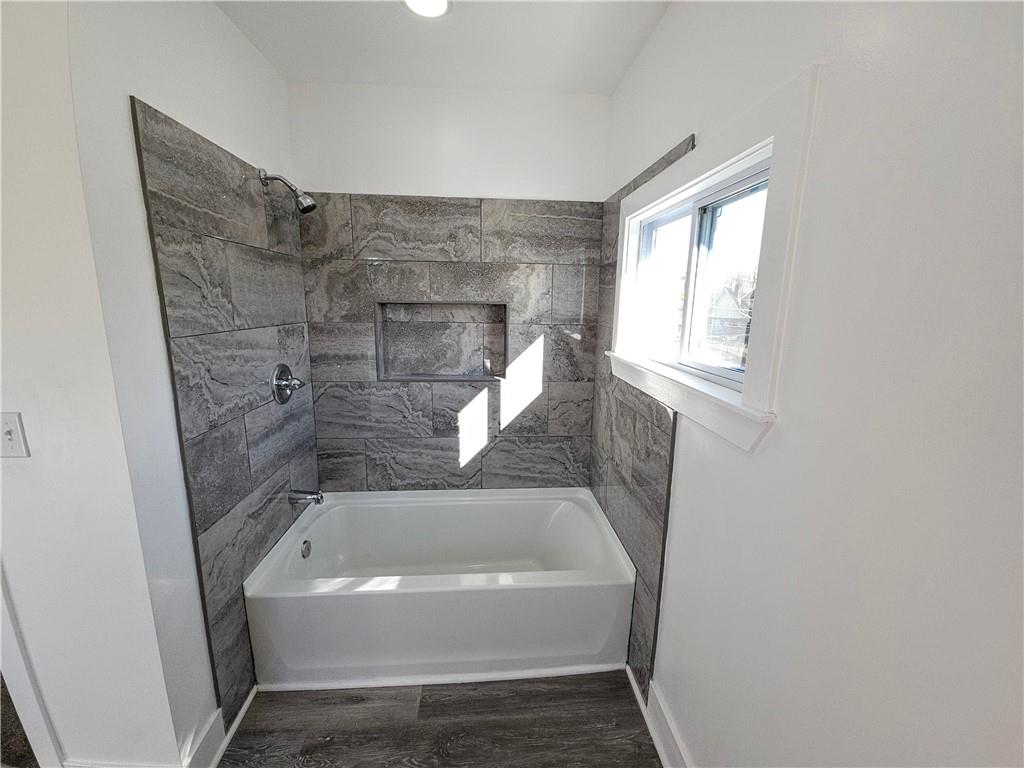 10200 Frankstown Road Pittsburgh, PA 15235 - Photo 31 of 47 a bathroom with a tub and shower