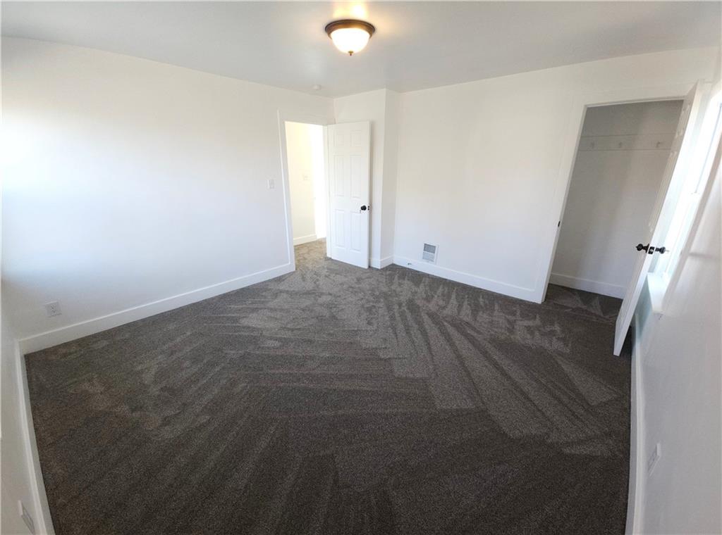 10200 Frankstown Road Pittsburgh, PA 15235 - Photo 33 of 47 an empty room with wooden floor and windows