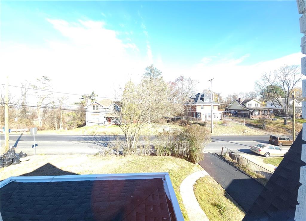 10200 Frankstown Road Pittsburgh, PA 15235 - Photo 35 of 47 a view of a swimming pool with a lawn chairs under an umbrella