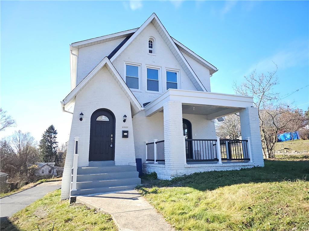 10200 Frankstown Road Pittsburgh, PA 15235 - Photo 5 of 47 a front view of a house with a yard