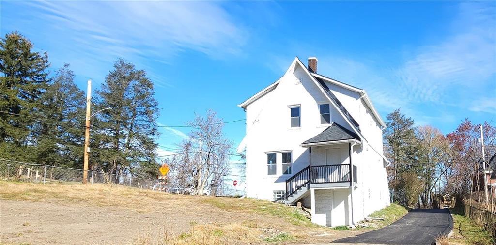 10200 Frankstown Road Pittsburgh, PA 15235 - Photo 7 of 47 a view of a house with a snow on the road