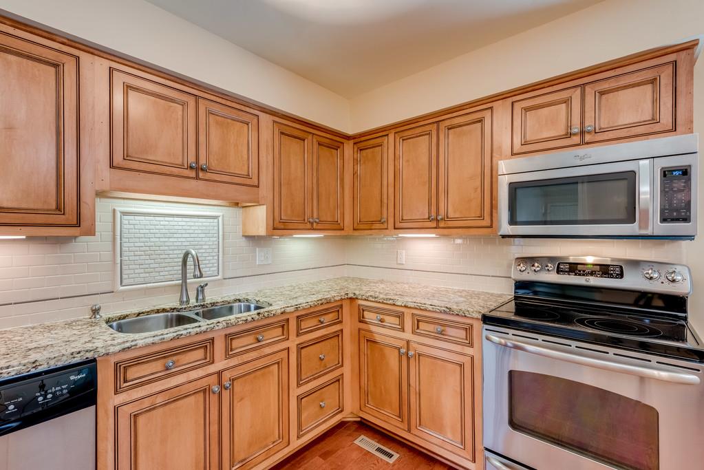 3801 Franklin Road Lebanon, TN 37090 - Photo 9 of 29 a kitchen with granite countertop a sink stove and microwave