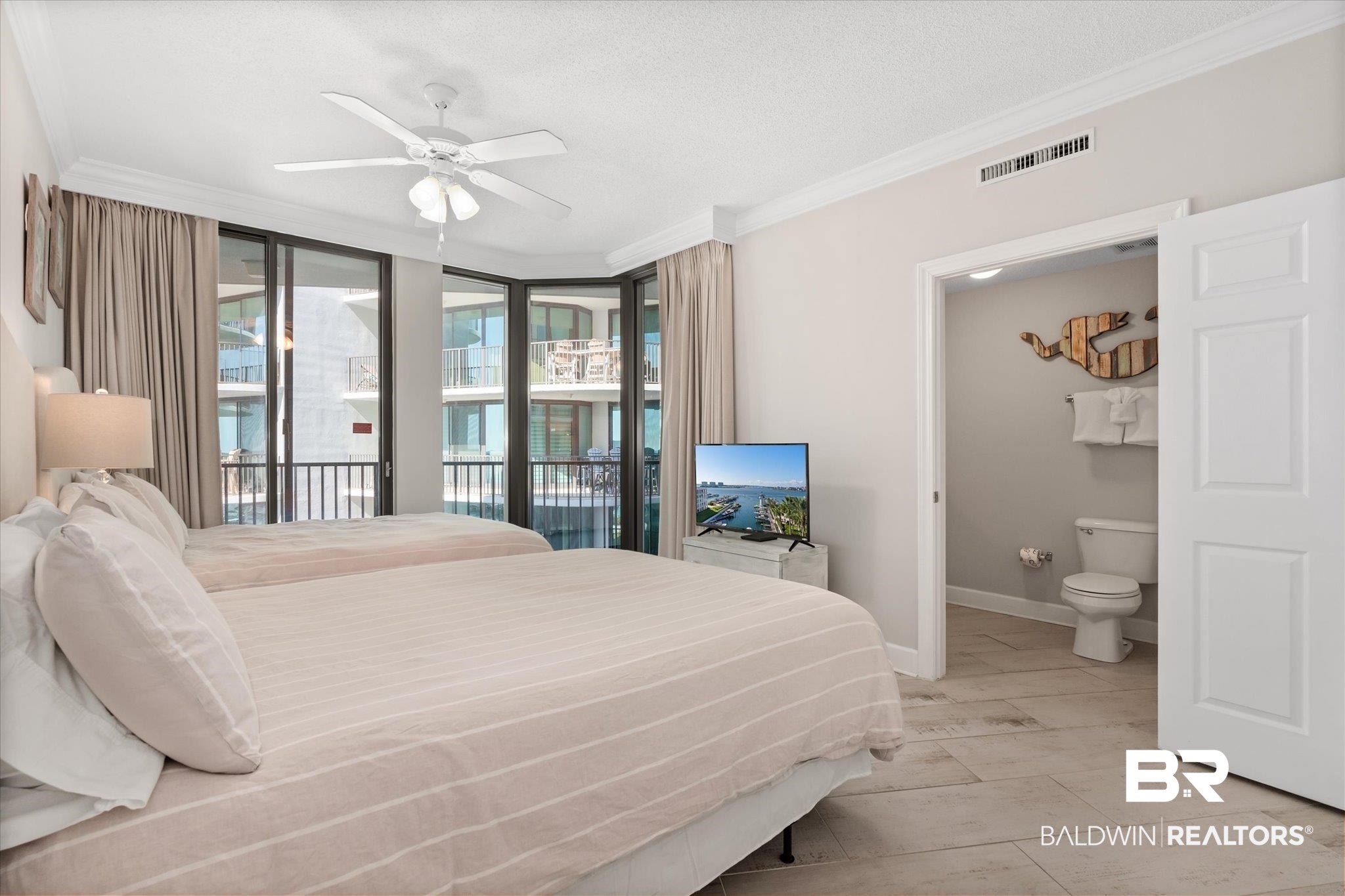 27582 Canal Road, Unit 2611 Orange Beach, AL 36561 - Photo 24 of 37 Bedroom featuring ensuite bath, ceiling fan, access to outside, and crown molding