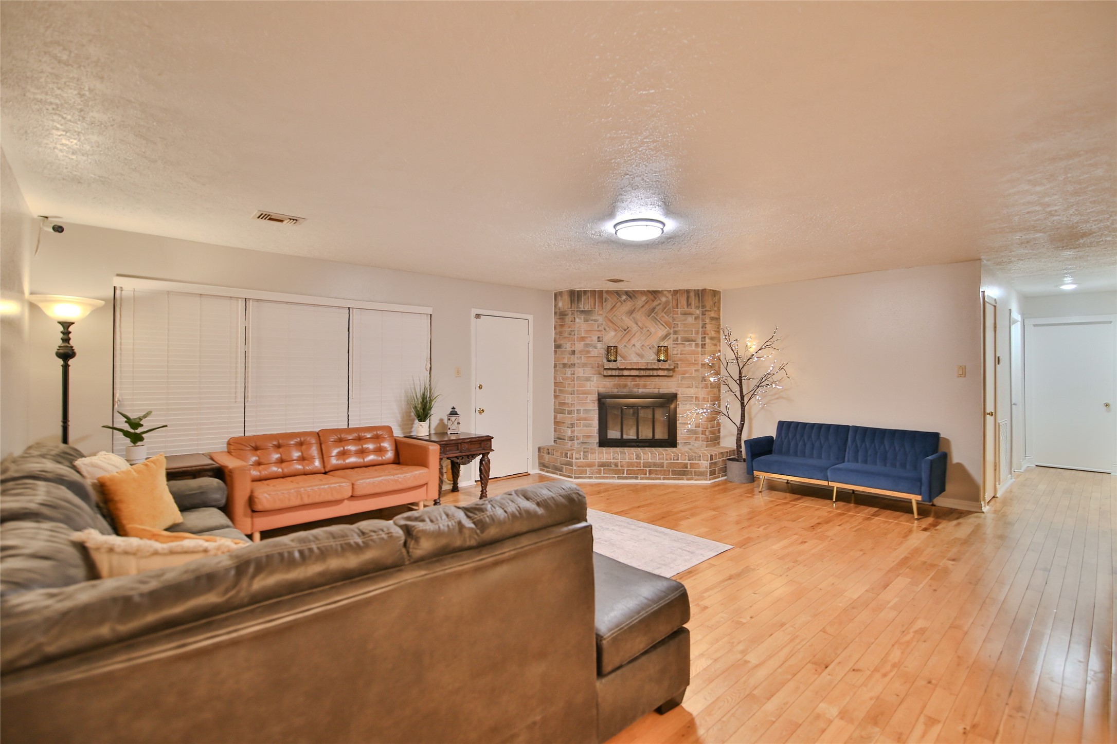 4947 Bridgemont Lane Spring, TX 77388 - Photo 9 of 29 a living room with furniture and a fireplace