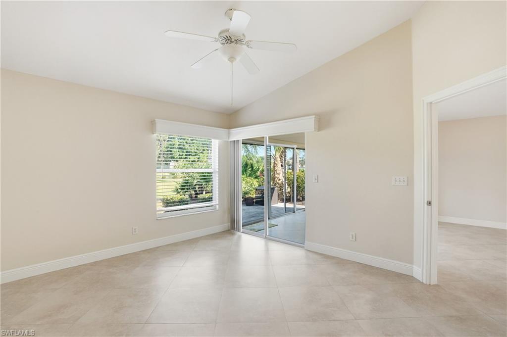 3724 Stone Way Estero, FL 33928 - Photo 18 of 35 Unfurnished room featuring lofted ceiling, a ceiling fan, and light tile patterned flooring