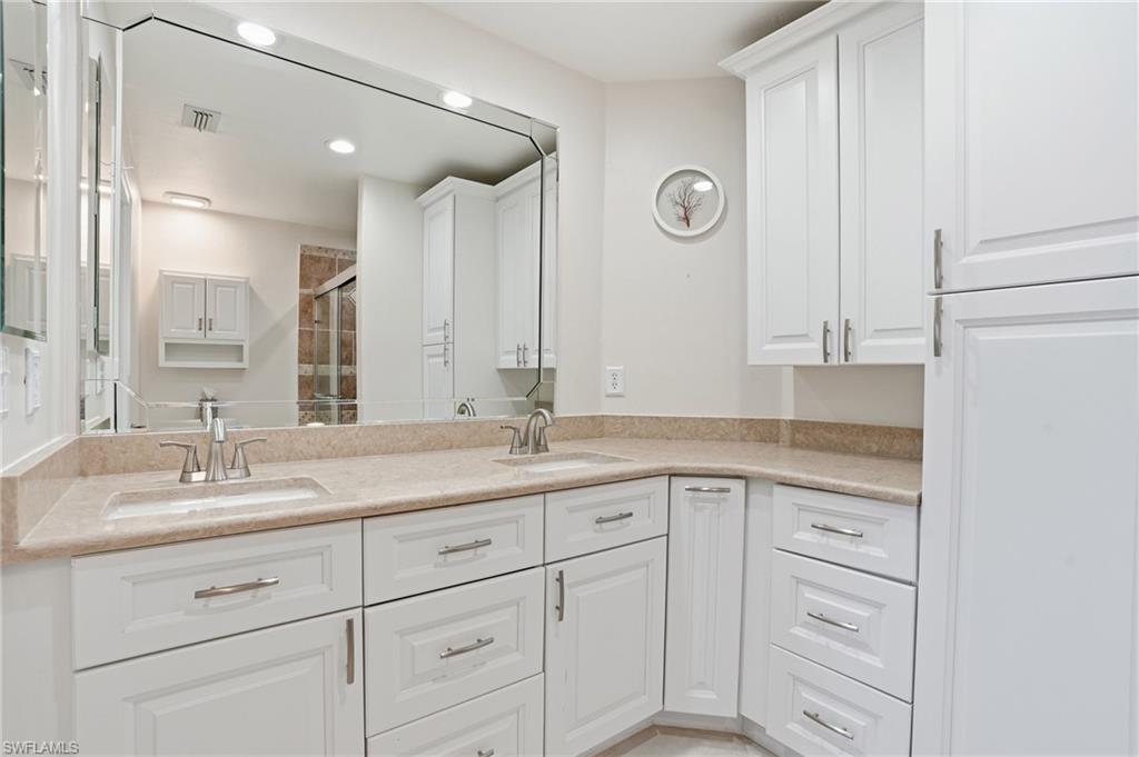 3724 Stone Way Estero, FL 33928 - Photo 20 of 35 Full bath featuring double vanity, a shower stall, and recessed lighting