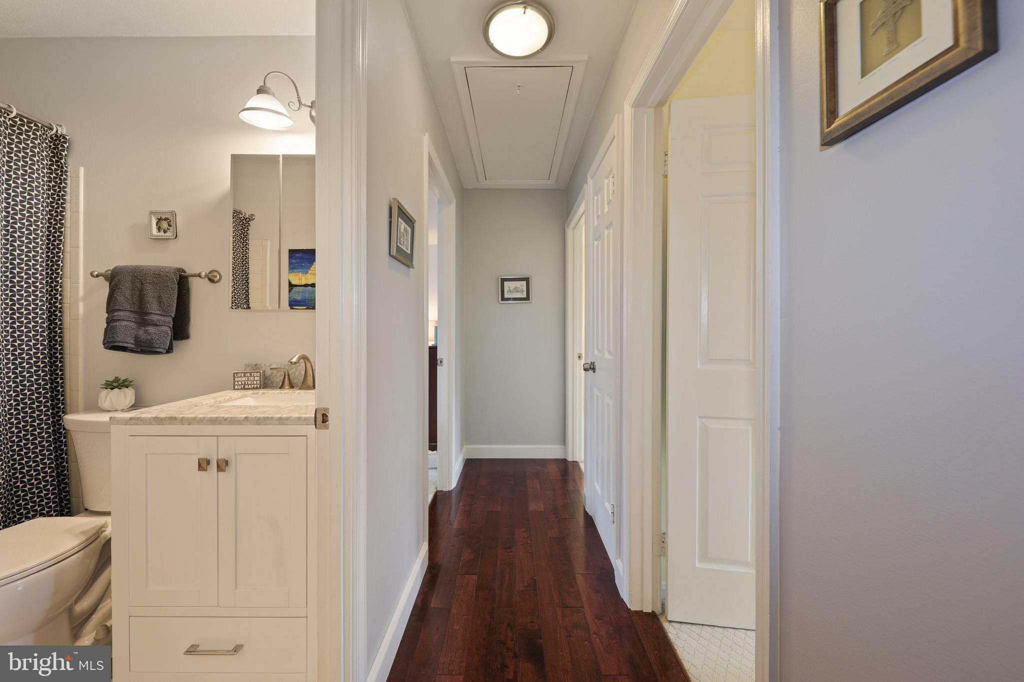 6671 Fairfax Road, Unit 90 Chevy Chase, MD 20815 - Photo 23 of 29 Upstairs hall with drop stair access to full attic