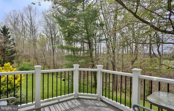 a view of a wooden deck and trees