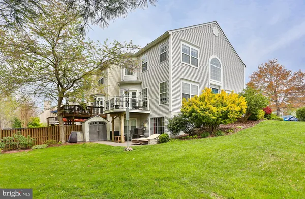 a view of house with yard and garden