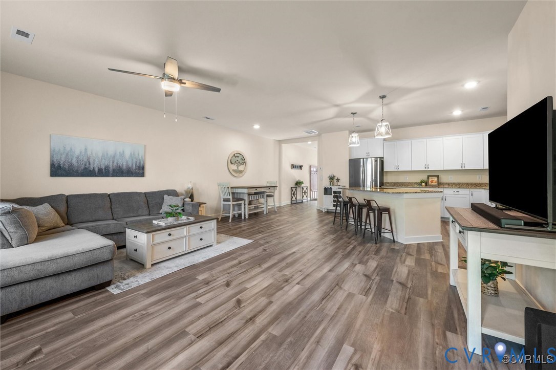 12576 Petrel Crossing Midlothian, VA 23112 - Photo 11 of 30 Living room featuring recessed lighting, dark wood