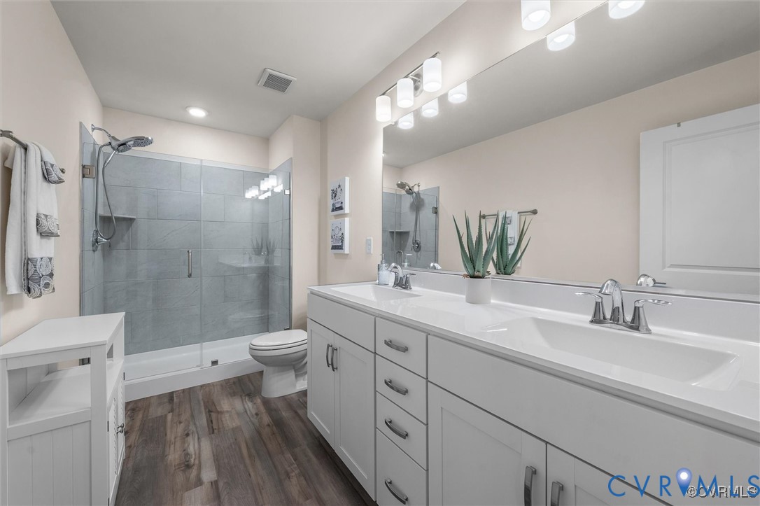 12576 Petrel Crossing Midlothian, VA 23112 - Photo 18 of 30 Full bath featuring double vanity, a stall shower,