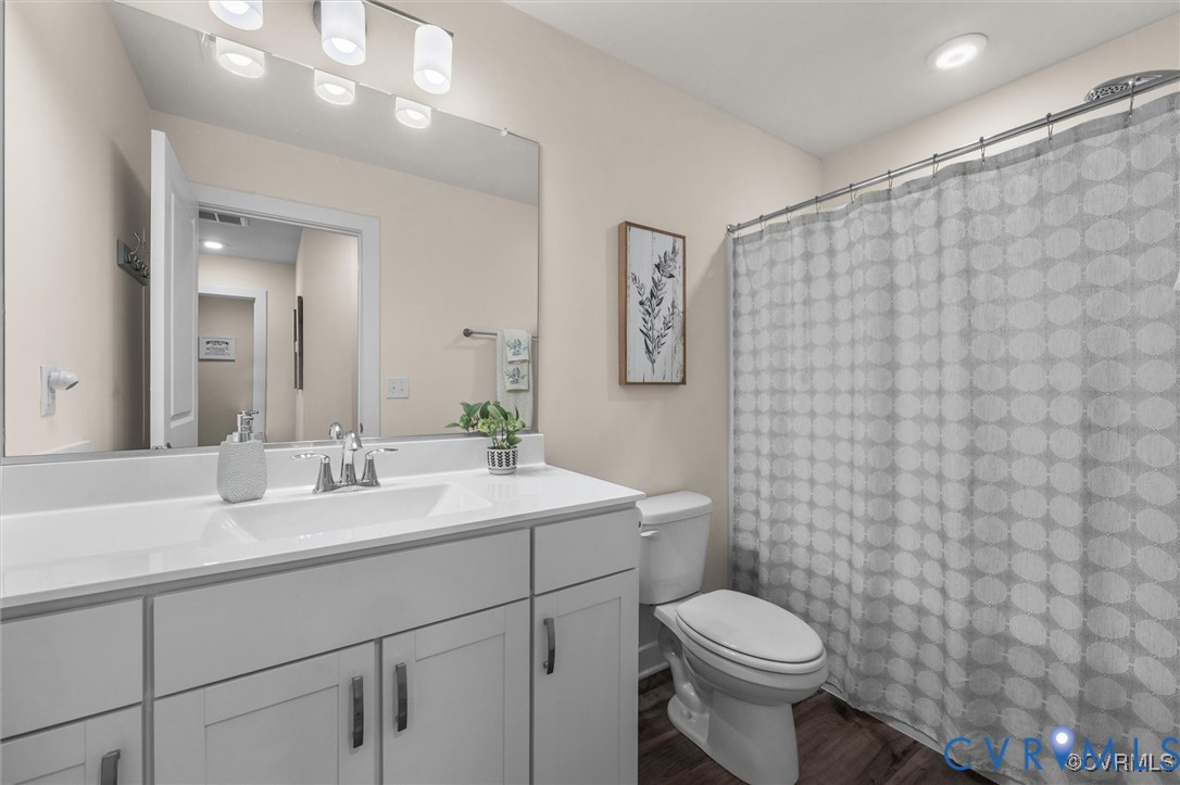 12576 Petrel Crossing Midlothian, VA 23112 - Photo 24 of 30 Bathroom with vanity, a shower with curtain, dark