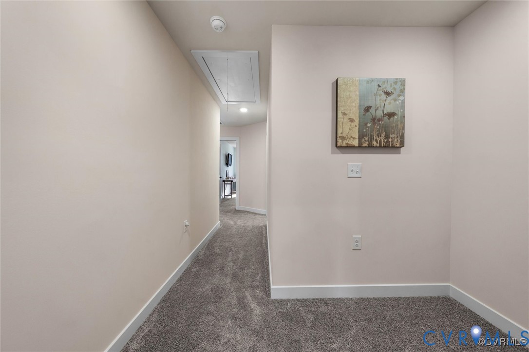 12576 Petrel Crossing Midlothian, VA 23112 - Photo 26 of 30 Corridor featuring attic access and dark carpet