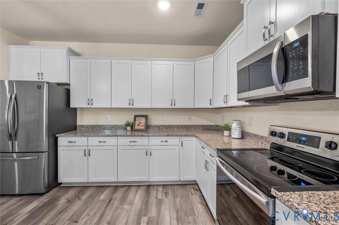 12576 Petrel Crossing Midlothian, VA 23112 - Photo 7 of 30 Kitchen with stainless steel appliances, white cab