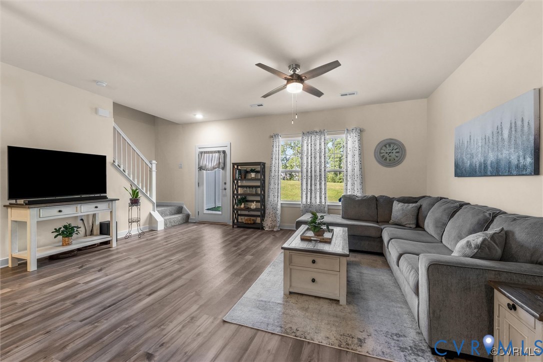 12576 Petrel Crossing Midlothian, VA 23112 - Photo 10 of 30 Living area featuring stairs, ceiling fan, and lig