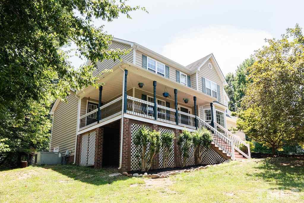 1224 Red Brick Road Garner, NC 27529 - Photo 2 of 30 a front view of a house with a yard