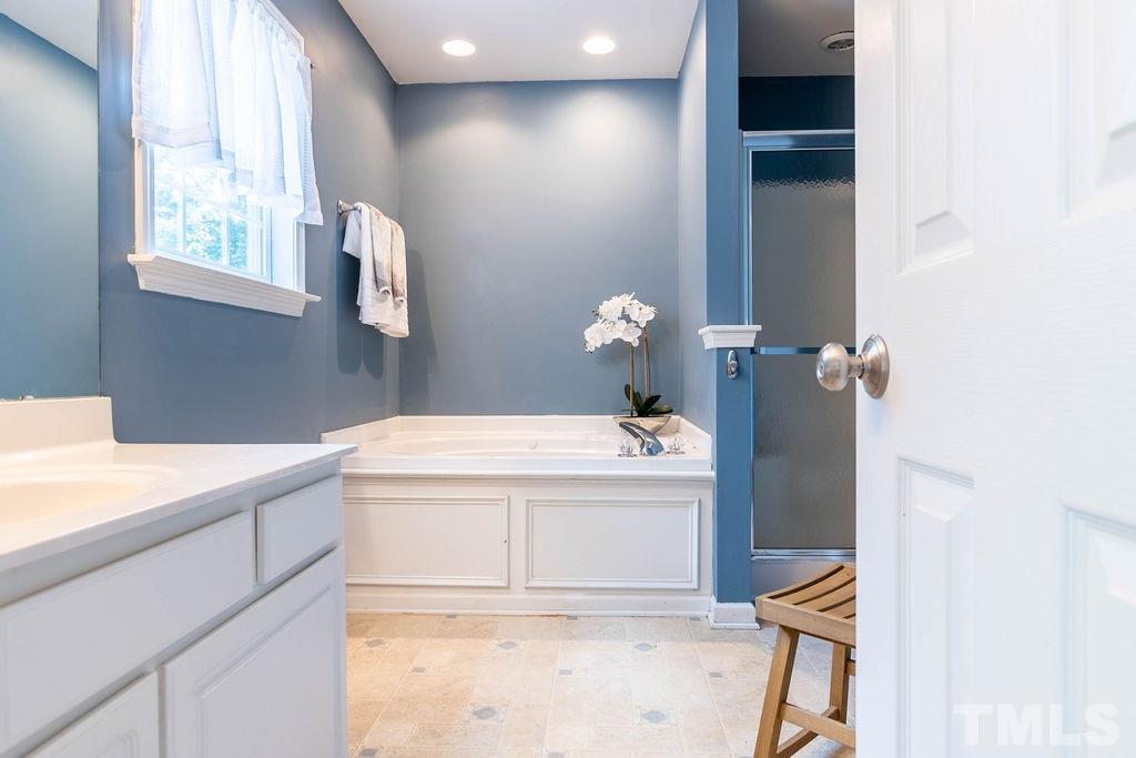 1224 Red Brick Road Garner, NC 27529 - Photo 15 of 30 a bathroom with a sink and a mirror