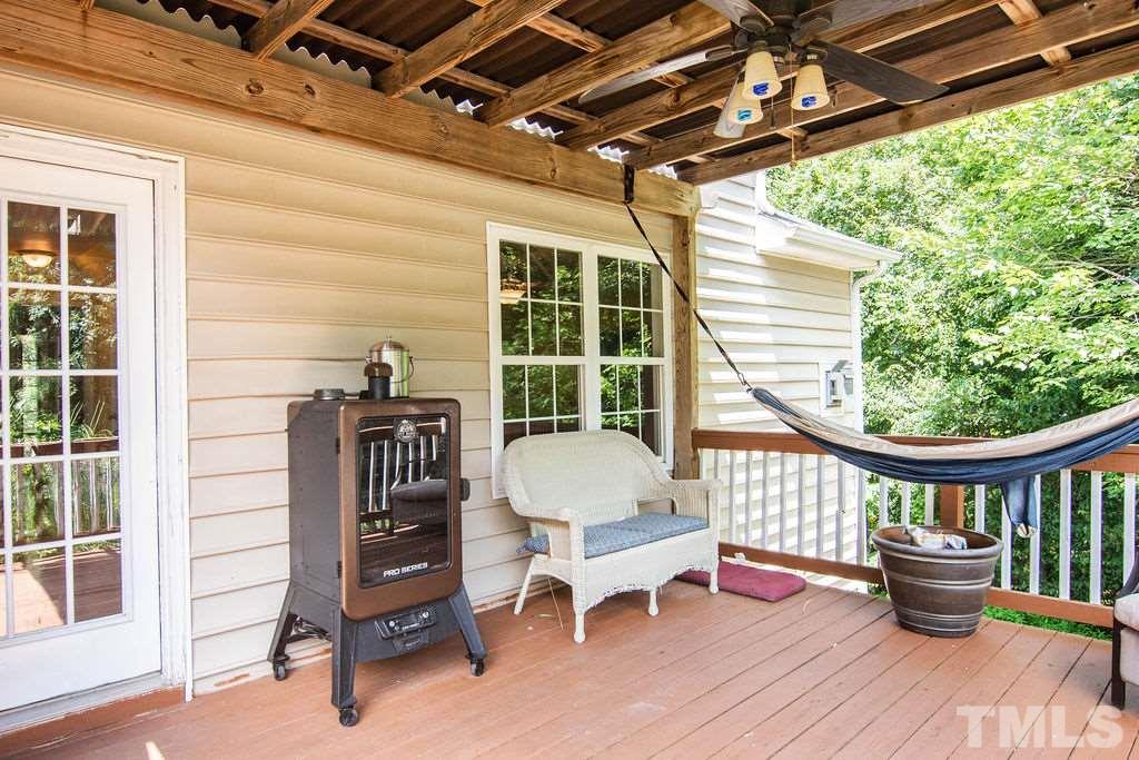 1224 Red Brick Road Garner, NC 27529 - Photo 24 of 30 a view of a porch with furniture and a yard