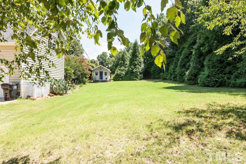 1224 Red Brick Road Garner, NC 27529 - Photo 29 of 30 a view of yard with swimming pool and trees