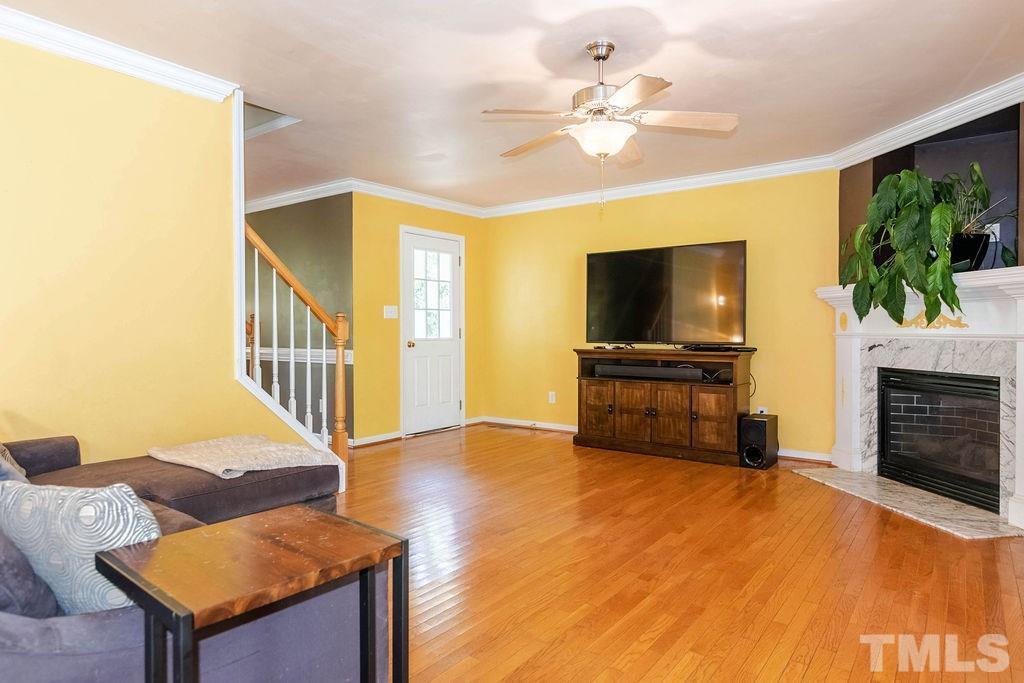 1224 Red Brick Road Garner, NC 27529 - Photo 4 of 30 a living room with furniture and a flat screen tv