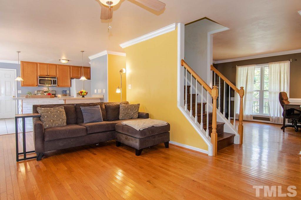 1224 Red Brick Road Garner, NC 27529 - Photo 5 of 30 a living room with furniture and a wooden floor