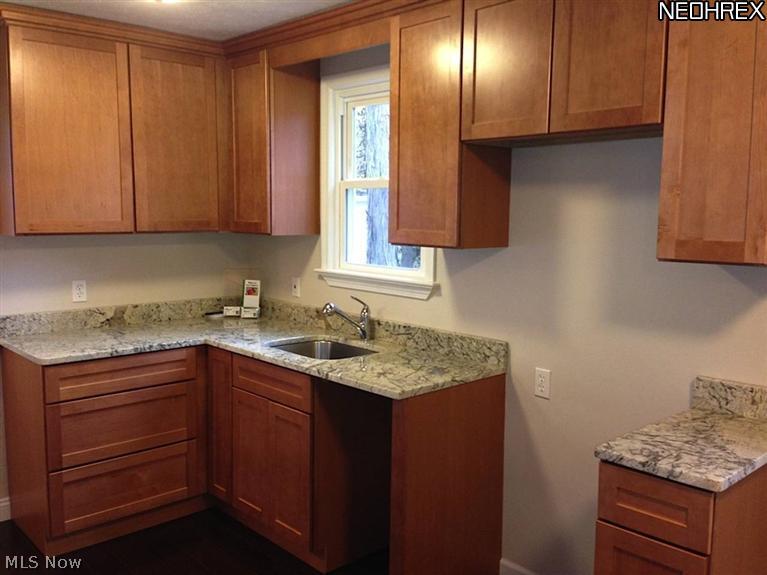 1186 Mayfield Ridge Road Cleveland, OH 44124 - Photo 2 of 10 Eat in kitchen with new cabinets and granite.