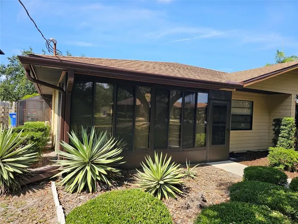 a front view of house and yard with seating space