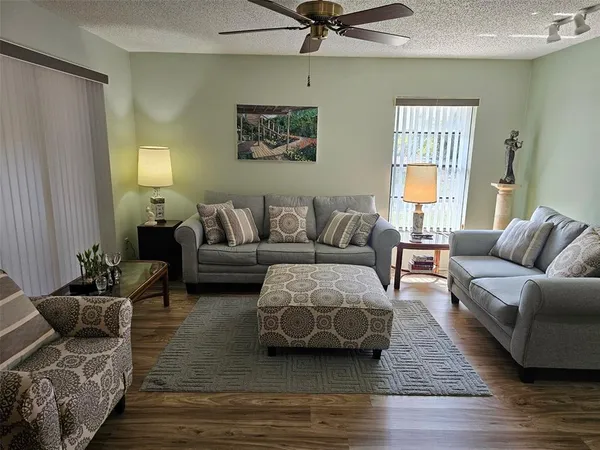 a living room with furniture and a window