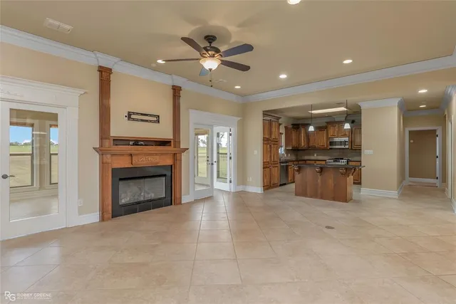 a view of kitchen with refrigerator and stove top oven